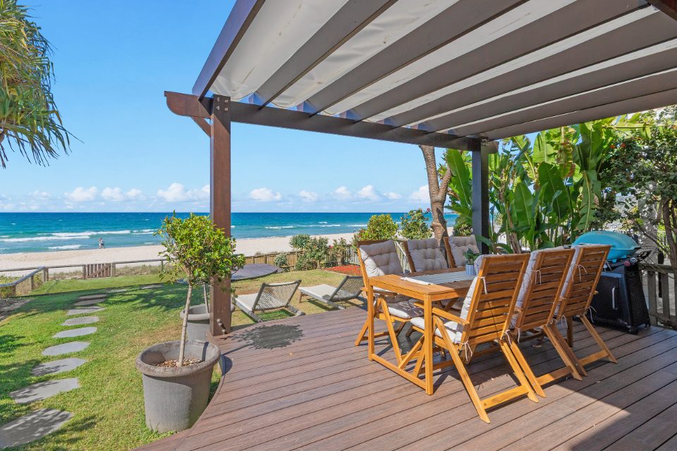 Beachfront deck with outdoor dining and ocean views at The Beach House by Sandbox, Palm Beach